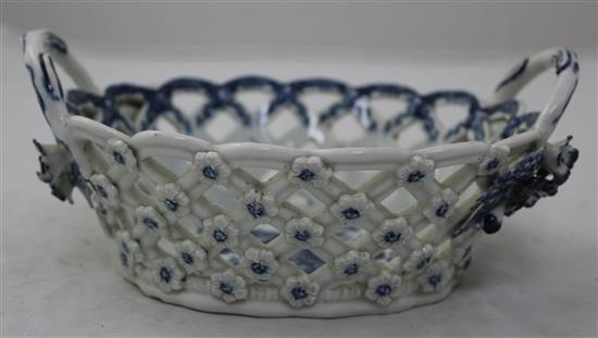 A Worcester Pine Cone pattern oval twin handled basket. c.1775, width 19cm, small losses to flowers